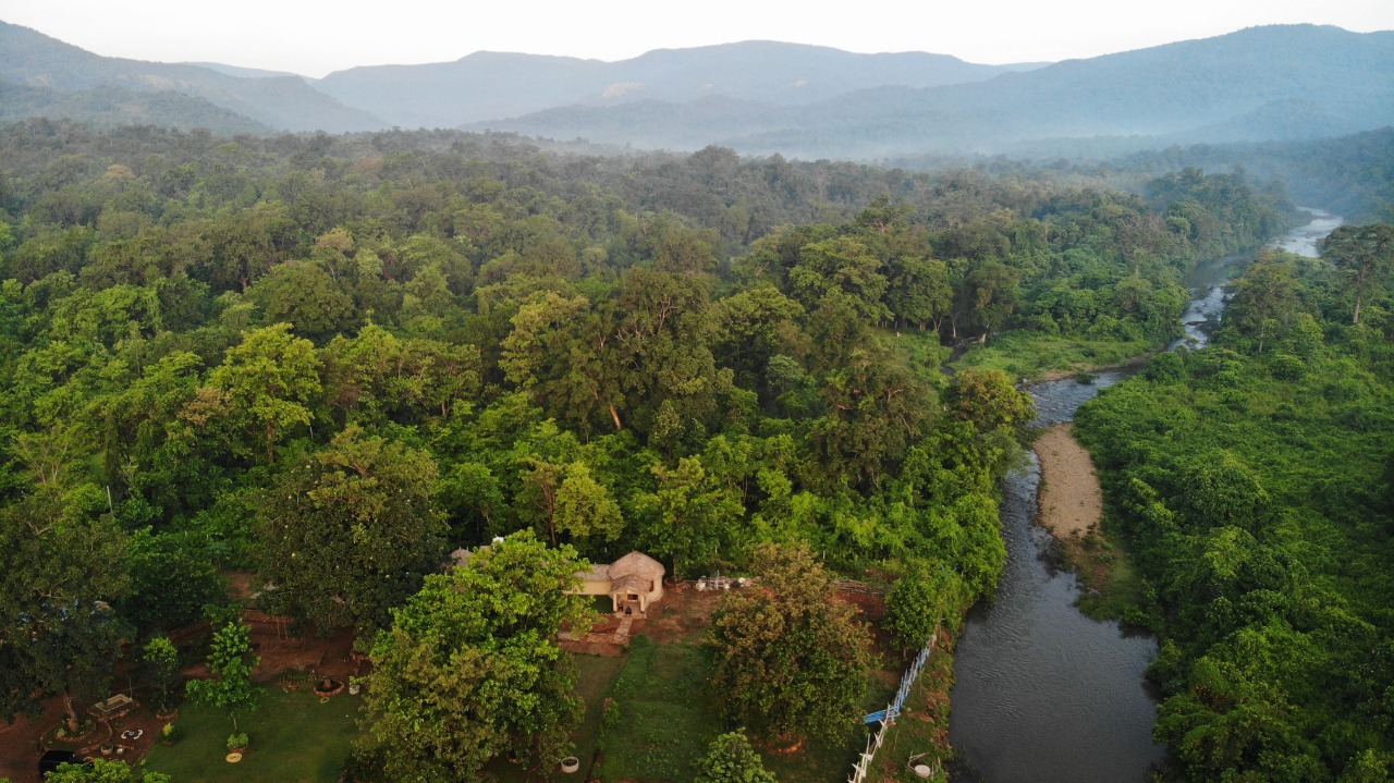 Aerial view of the forest and river near Similipal Eco Cottage